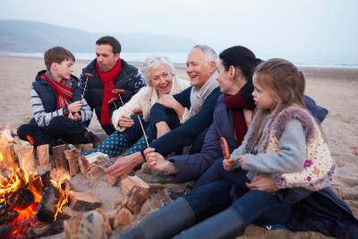 Three generations of family visiting fireside.